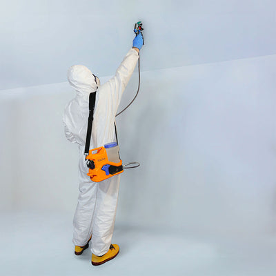 Cordless Airless Sprayer painter paints a wall and ceiling