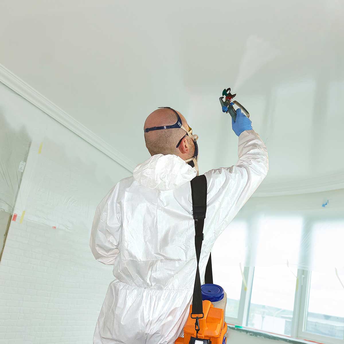 Painter paints a ceiling with Cactus Airless Sprayer