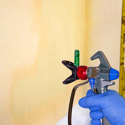 Cactus Airless Sprayer paints a wall